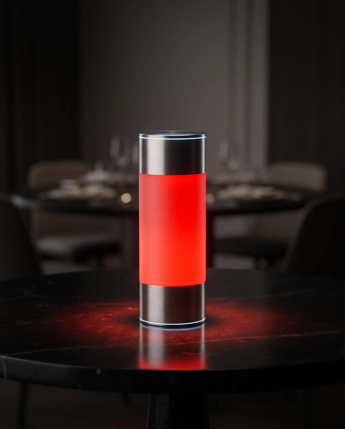 Halune lamp glowing red on a dining table